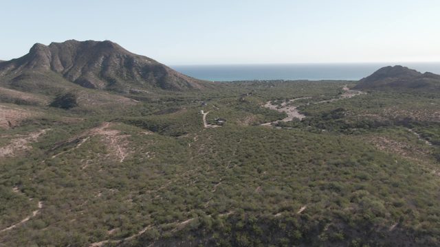 CABO PULMO BCS MEXICO-2022: Hilly Green Landscape with Distant Ocean
