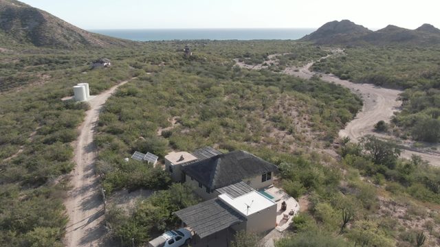CABO PULMO BCS MEXICO-2022: Truck Driving Away From House in Desert