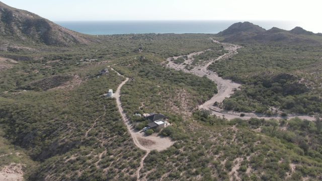 CABO PULMO BCS MEXICO-2022: Hilly Landscape with Dirt Roads and Small Building