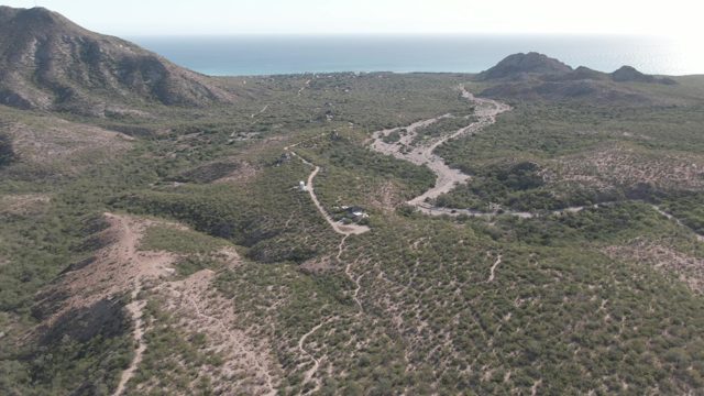 CABO PULMO BCS MEXICO-2022: Winding Dirt Road Through Arid Mountain Terrain
