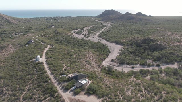 CABO PULMO BCS MEXICO-2022: Rising Aerial View of Rural Property and Coastal Hills