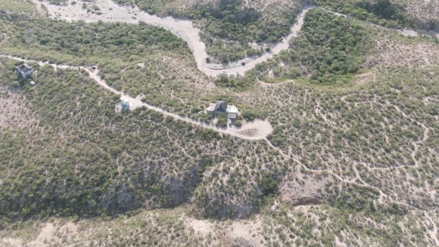 CABO PULMO BCS MEXICO-2022: Vehicle Traveling on Winding Hillside Dirt Path