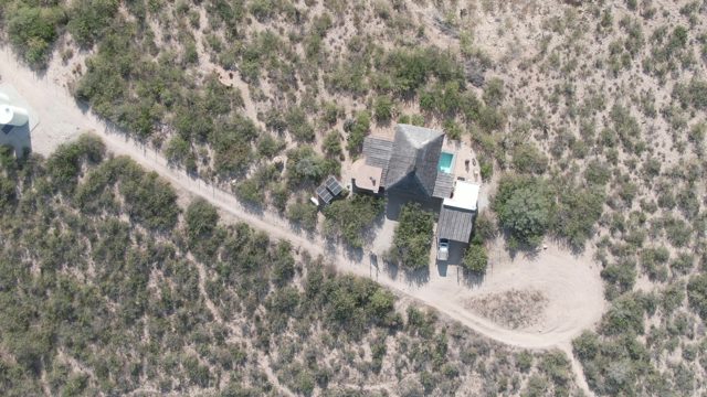 CABO PULMO BCS MEXICO-2022: Desert House and Dirt Road with Sparse Shrubs