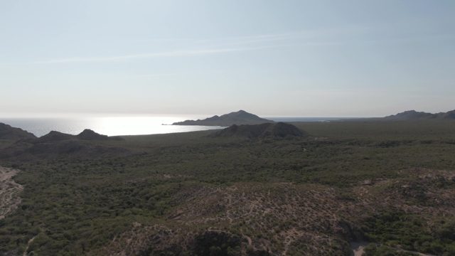 CABO PULMO BCS MEXICO-2022: Hills, Ocean, and a Moving Figure in the Foreground