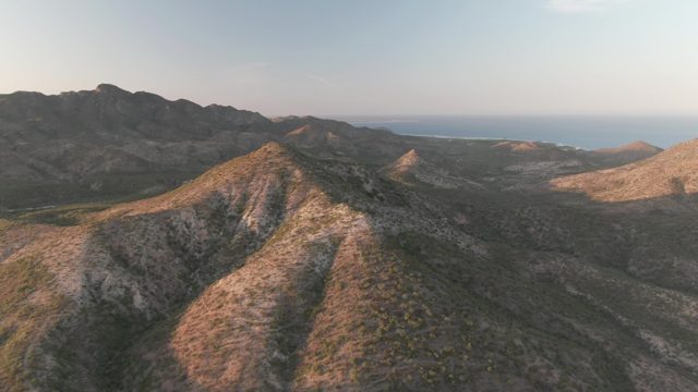 CABO PULMO BCS MEXICO-2022: Rugged Mountain Peaks with Ocean Horizon and Shifting Shadows