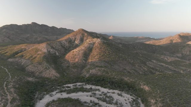 CABO PULMO BCS MEXICO-2022: Descent over Mountain Valley Revealing Winding Path