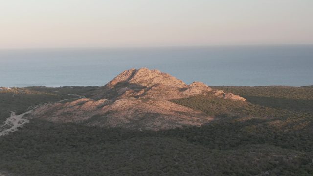 CABO PULMO BCS MEXICO-2022: Rocky Hill and Forested Landscape by the Ocean