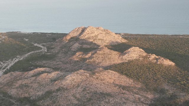 CABO PULMO BCS MEXICO-2022: Shifting Shadows over Coastal Rocky Hills and Winding Road