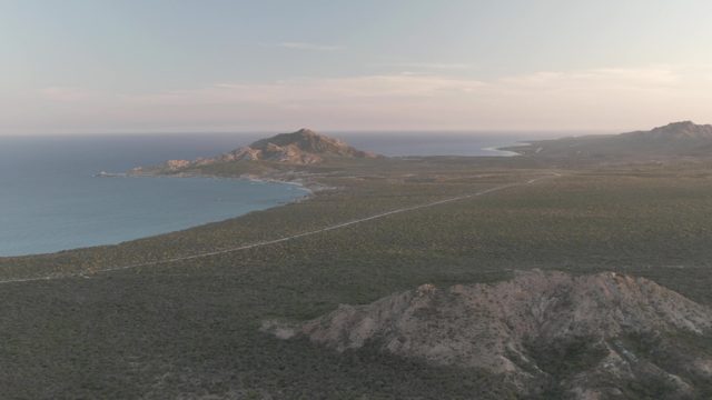 CABO PULMO BCS MEXICO-2022: Coastal Mountain Road with Moving Vehicle