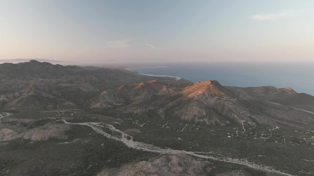 CABO PULMO BCS MEXICO-2022: Winding Mountain Road with Ocean in the Distance