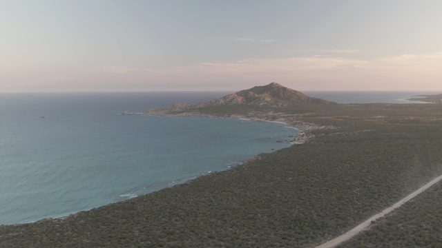 CABO PULMO BCS MEXICO-2022: Vehicle Driving Along Coastal Road, Kicking Up Dust