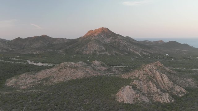 CABO PULMO BCS MEXICO-2022: Vehicles Moving Along Road in Mountainous Landscape