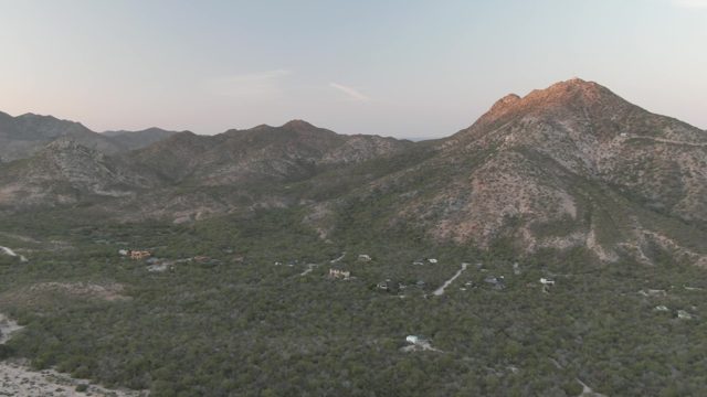 CABO PULMO BCS MEXICO-2022: Vehicle Moving on Mountain Road Through Forested Valley