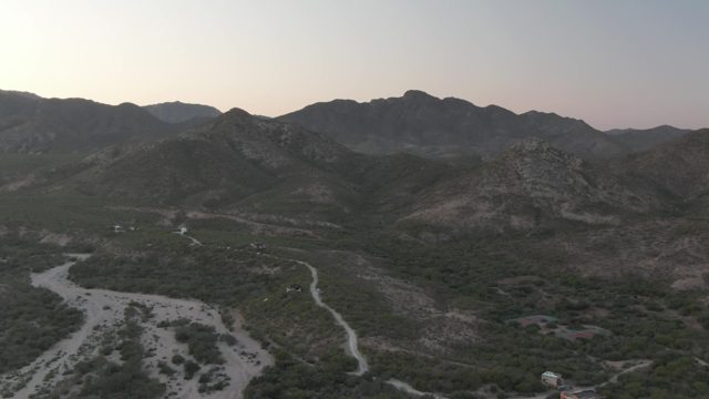 CABO PULMO BCS MEXICO-2022: Vehicle Moving Along Mountain Valley Dirt Road