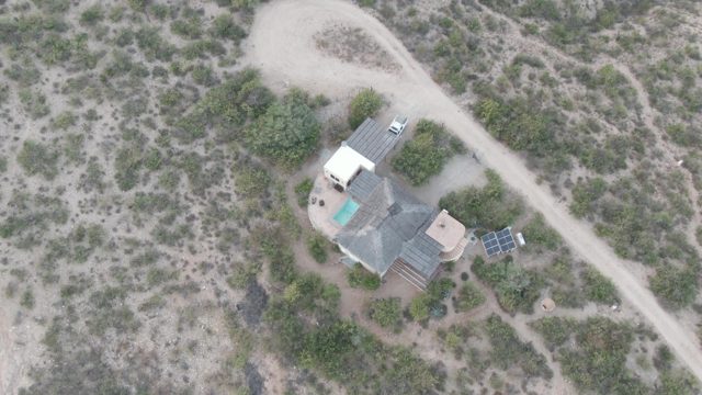 CABO PULMO BCS MEXICO-2022: Aerial Approach to Desert House with Solar Panels