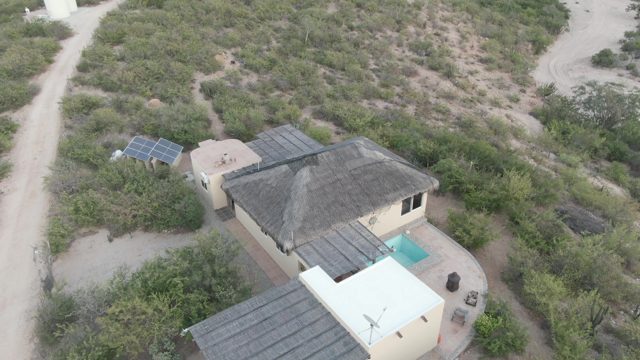 CABO PULMO BCS MEXICO-2022: Person Walking near Rural House with Solar Panels