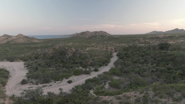 CABO PULMO BCS MEXICO-2022: Winding Dirt Road Through Hilly Vegetation