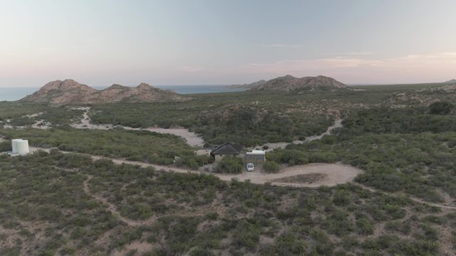 CABO PULMO BCS MEXICO-2022: Vehicle Moving near Desert Building and Tank