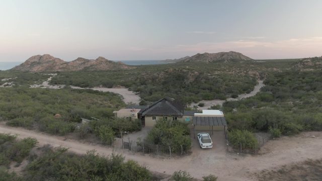 CABO PULMO BCS MEXICO-2022: Desert House with Car and Mountain Backdrop