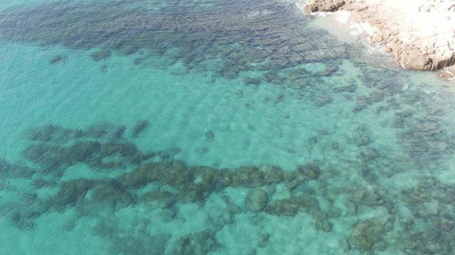 BUZZARDS EAST CAPE LOS CABOS BCS MEXICO-2022: Clear Turquoise Water with Visible Underwater Rocks by Shore
