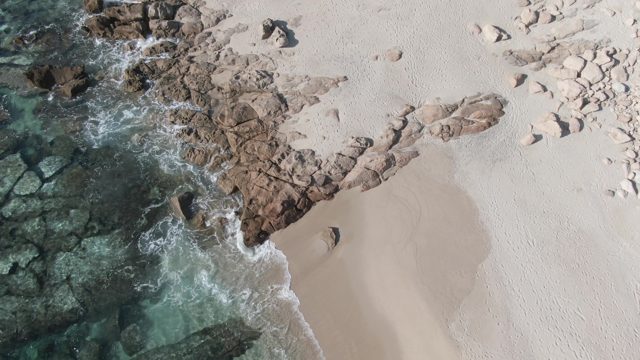 BUZZARDS EAST CAPE LOS CABOS BCS MEXICO-2022: Rocky Beach with Clear Turquoise Water and Gentle Waves