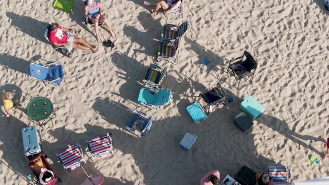 SHIPWRECKS BEACH EAST CAPE LOS CABOS BCS MEXICO-2022: Beachgoers Relaxing on Sand with Folding Chairs