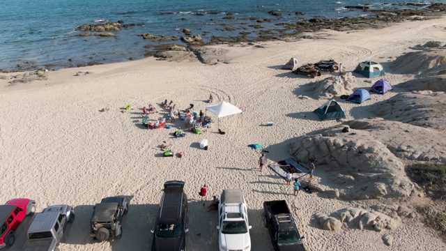 SHIPWRECKS BEACH EAST CAPE LOS CABOS BCS MEXICO-2022: Beachgoers and Campers on Sandy Shore