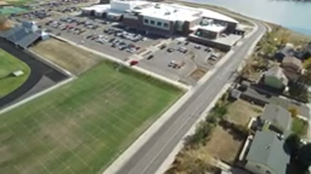 HIDDEN LAKE COLORADO-2016: Aerial View Approaching A School With Athletic Fields