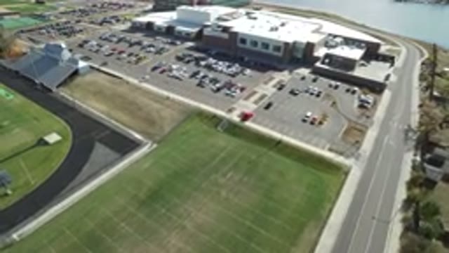 HIDDEN LAKE COLORADO-2016: Moving Aerial View Of Building Parking Lot And Sports Fields