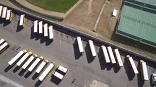 HIDDEN LAKE COLORADO-2016: Plane Flying Over Parking Lot With Lots Of Vans