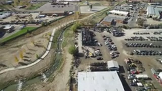 HIDDEN LAKE COLORADO-2016: View Of Lots Of Vehicles And Building Surrounded By