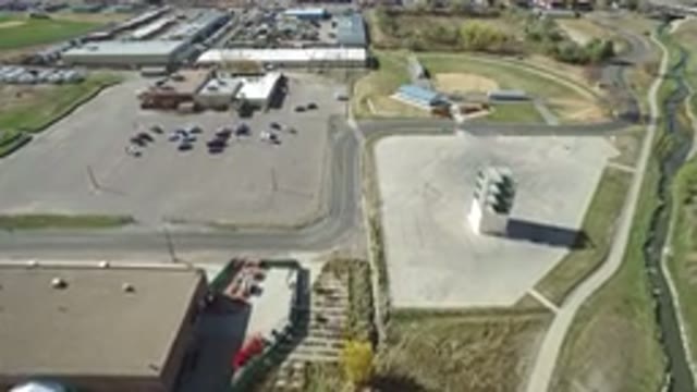 HIDDEN LAKE COLORADO-2016: A Large Patio With Sheds Parking A Tower With Several