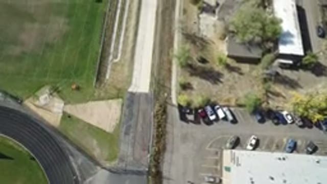 HIDDEN LAKE COLORADO-2016: Top View Of A Green Football Field Surrounded By A