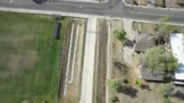HIDDEN LAKE COLORADO-2016: View Of A City With Buildings And Vehicles Around