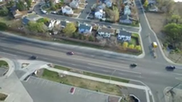 HIDDEN LAKE COLORADO-2016: A Top View Of Cars Moving On A Major Road With Houses