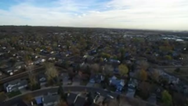 HIDDEN LAKE COLORADO-2016: The Camera Is Flying Above A Town Showing Many Trees