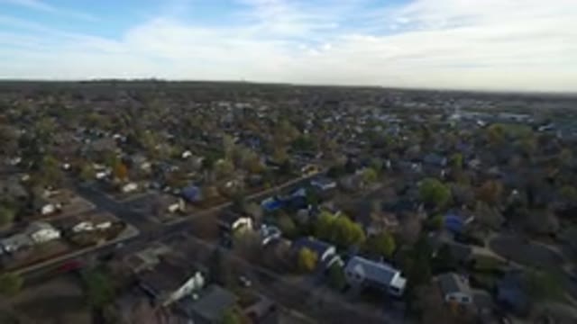 HIDDEN LAKE COLORADO-2016: Drone Flying Over Town City Showing Buildings Trees