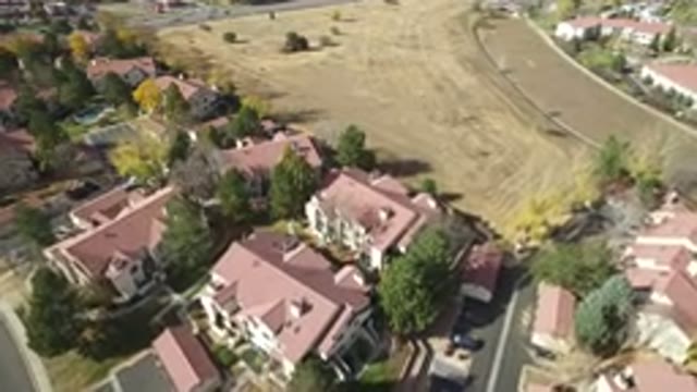 HIDDEN LAKE COLORADO-2016: Aerial View Of A City With Houses Lots Of Trees And A