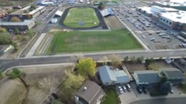 HIDDEN LAKE COLORADO-2016: Aerial Filming A Green Landmark With A Big Stadium