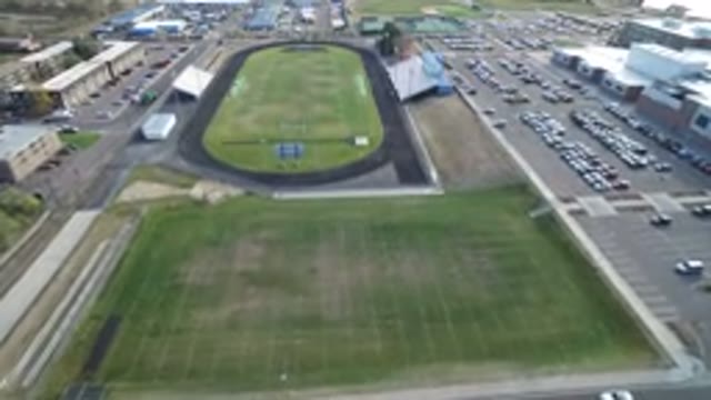 HIDDEN LAKE COLORADO-2016: Empty Sports Stadium Green Grass Gray Track