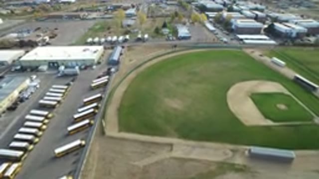 HIDDEN LAKE COLORADO-2016: Flying Over A Field With Trucks On The Side