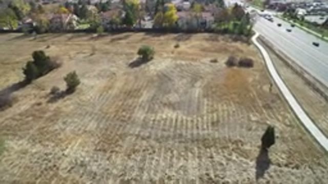 HIDDEN LAKE COLORADO-2016: Plowed Open Area Near A Small Area With Houses And Trees