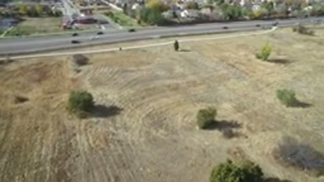 HIDDEN LAKE COLORADO-2016: Plowed Open Area Near Separated From An Area With Trees And Houses
