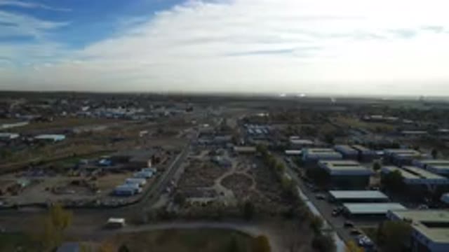 HIDDEN LAKE COLORADO-2016: Plane Flying Above City With Clouds Up Top View