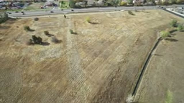 HIDDEN LAKE COLORADO-2016: Aerial View of Fields, Shrubs, and Road in Background