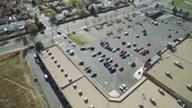 HIDDEN LAKE COLORADO-2016: Traffic In A Large Parking Lot With Cars On The Track