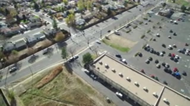 HIDDEN LAKE COLORADO-2016: Drone Free Flying Over Busy Street During Afternoon