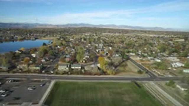 HIDDEN LAKE COLORADO-2016: Aerial View Of Suburbs Grass Field And Small Lake