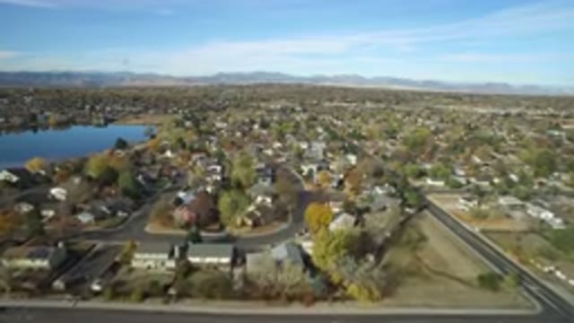 HIDDEN LAKE COLORADO-2016: Aerial View Of Neighborhood Near Lake With Mountains