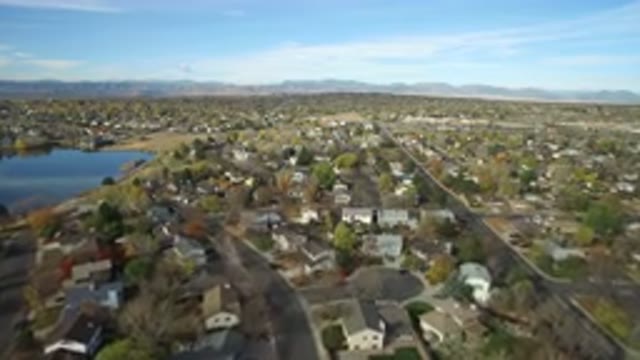 HIDDEN LAKE COLORADO-2016: Top View Of A Residential Area With Houses Lake And Mountains
